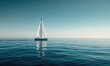 A sailboat gliding across the calm waters of the ocean