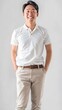 © Lin_Studio - A handsome japanese man, standing, wearing a white  polo shirt, with hand in the pocket