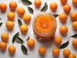 Orange jam filled jar on white background with fresh oranges 