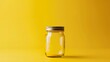 Clear Glass Jar Shines on Sunny Yellow Background