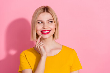 Sticker - Photo of cute tricky lady dressed yellow t-shirt finger chin looking empty space isolated pink color background