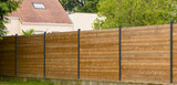 Fototapeta Sypialnia - Clôture en panneaux de bois	
