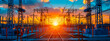© AshrafulIslam - Sunset over power lines, silhouette of electricity towers against vibrant sky