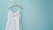 Mockup of white women cotton dress on blue background. Layout mock up ready for your design preview.