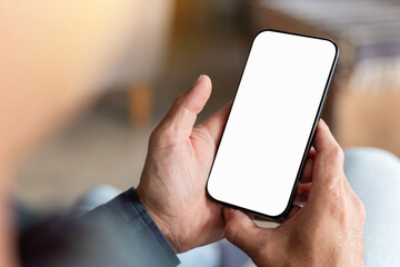 cell phone blank white screen mockup.hand holding texting using mobile on desk at office.background empty space for advertise.work people contact marketing business,technology