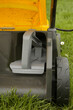 Close up image of lawn mower with inserted mulching plug, a cutting function that finely shreds the clippings and spreads it over the ground as a fertiliser.