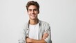 © Jardel Bassi - Young Handsome Man with a Friendly Smile and Casual Attire, Crossed Arms on White Background