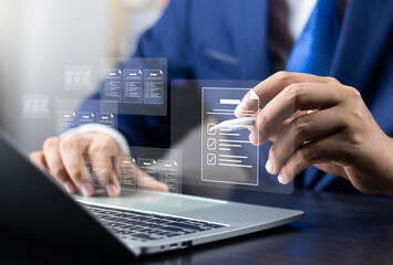 Canvas Print - Business performance monitoring and evaluation concept, Take an assessment, Business man using laptop and tablet online checklist survey, Filling out digital checklist, Questionnaire with checkboxes.