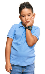 Sticker - Little boy hispanic kid wearing casual clothes thinking looking tired and bored with depression problems with crossed arms.