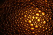 Burbujas doradas de agua y jabón sobre una superficie texturizada, con luz en el centro difuminada hacia los bordes, producen un efecto abstracto muy original para los fondos.