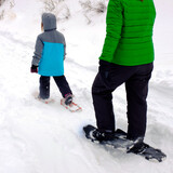 Fototapeta Las - Family Snowshoeing in the Winter Snow kids having fun