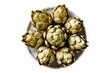 Fresh and raw artichokes on a table, topview and isolated