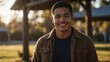 young pacific islander man on morning sunlight winter park background smiling happy looking at camera with copy space for banner backdrop from Generative AI