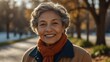 elderly multiracial lady woman on morning sunlight winter park background smiling happy looking at camera with copy space for banner backdrop from Generative AI