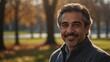 middle aged middle eastern man on morning sunlight winter park background smiling happy looking at camera with copy space for banner backdrop from Generative AI