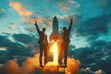 Fototapeta Sport - Silhouettes of two people with arms raised in victory as a rocket launches at sunset