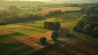 An aerial view of a tranquil countryside dotted with patchwork fields and farmhouses