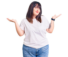 Poster - Young plus size woman wearing casual clothes clueless and confused expression with arms and hands raised. doubt concept.