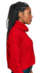 Wall Mural - African american woman wearing casual winter sweater looking to side, relax profile pose with natural face with confident smile.