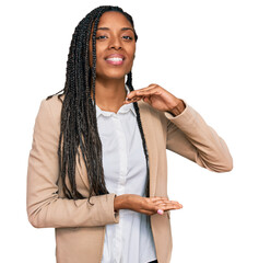 Wall Mural - African american woman wearing business jacket gesturing with hands showing big and large size sign, measure symbol. smiling looking at the camera. measuring concept.