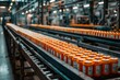 © kaleidoscope - Orange cans moving along a conveyor belt in a factory