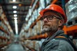 © gearstd - Warehouse worker in hard hat looking away
