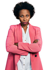 Poster - African american woman with afro hair wearing business jacket skeptic and nervous, disapproving expression on face with crossed arms. negative person.