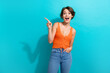Photo of speechless woman with bob hair dressed knitwear singlet indicating at offer empty space isolated on turquoise color background