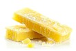 Yellow, cubed lemon jelly candies on a white background, perfect for sweet shops, confectionery marketing, and recipe websites.