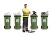 Cleaner in a uniform holding a broom in front of recycling bins