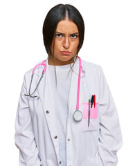 Canvas Print - Beautiful hispanic woman wearing doctor uniform and stethoscope skeptic and nervous, frowning upset because of problem. negative person.