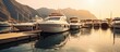 Motor yachts moored at the pier against the backdrop of mountains and the sun at sunset AI generated