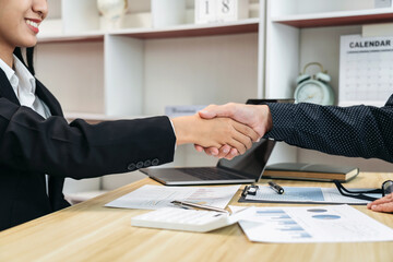 Aufkleber - Two businesspeople shaking hands in a business meeting