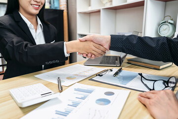 Aufkleber - Two businesspeople shaking hands in a business meeting