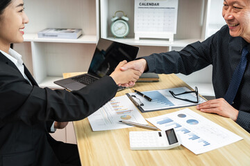Aufkleber - Two businesspeople shaking hands in a business meeting