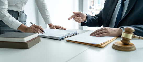 Wall Mural - Businesswoman and Male lawyer or judge consult and conference having team meeting with client at law firm in office, Law and Legal services concept