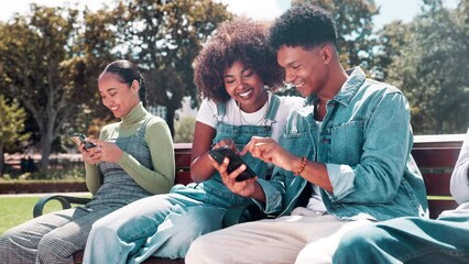 Wall Mural - Happy friends, bench and browsing with phone for social media, entertainment or networking at outdoor park. Man and woman or students relaxing with smile on mobile smartphone or internet in nature