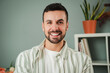 © Jose Calsina - Close up portrait of one handsome guy with perfect white teeth smiling at home. Front view of young confident man with friendly and positive expression. Happy adult male laughing and looking at camera