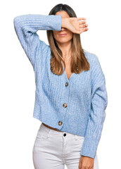 Wall Mural - Young woman wearing casual clothes covering eyes with arm, looking serious and sad. sightless, hiding and rejection concept