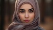 Portrait of beautiful young muslim arabian woman wearing white hijab looking at camera