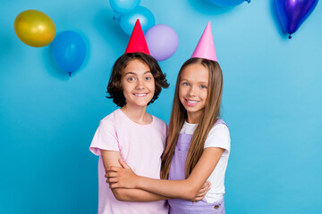 Canvas Print - Photo of sweet charming friends wear casual outfits birthday caps embracing isolated blue color background