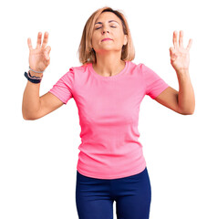 Wall Mural - Young blonde woman wearing sportswear relaxed and smiling with eyes closed doing meditation gesture with fingers. yoga concept.