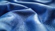 Detailed shot of blue leather material, suitable for backgrounds or textures