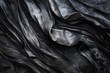 A close-up of a black cloth on a table. Suitable for various concepts and designs