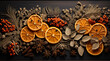 Dried orange slices and spices on dark wooden background