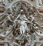 Fototapeta  - MILAN, ITALY - SEPTEMBER 16, 2024: The detail from main bronze gate of the Cathedral -   Deposition (Pieta) by Ludovico Pogliaghi (1906).