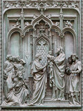 Fototapeta  - MILAN, ITALY - SEPTEMBER 16, 2024: The detail from main bronze gate of the Cathedral -   Presentation of Jesus in the temple -  by Ludovico Pogliaghi (1906).