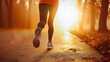 © bmf-foto.de - bodypart of legs of a female person jogging on the road at sunset or sundown in a foggy day