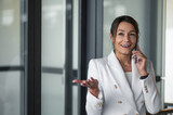 Fototapeta Młodzieżowe - Portrait of a business woman with a phone in hand