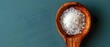 Ayurvedic Nasal Irrigation: Using a Spoon to Combine Neti Pot Salt for Sinus Cleansing and Salt Therapy. Concept Sinus Cleansing, Ayurvedic Remedies, Neti Pot Usage, Nasal Irrigation Benefits